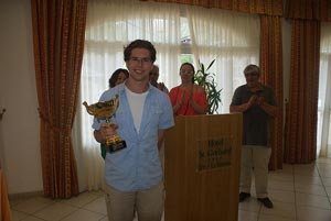 Winner Jon Ludwig with his trophy. He wondered how much it would cost him to transport on Ryan Air. Photo © 