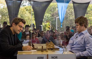 Number 1 and 2 in the world meet. Levon Aronian and Magnus at the start of Round 4. Photo © Albert Silver.