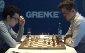 Fabiano Caruana vs Magnus Carlsen in Round 1. Photo © 