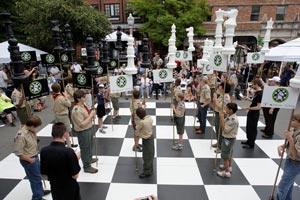 Human chess during an event co-hosted by the World Chess Hall of Fame and the Chess Club and Scholastic Center of Saint Louis to launch the first-ever Chess Merit Badge for the Boy Scouts of America. Grandmaster Hikaru Nakamura participated in the event and stood in as the black King. Photo © 