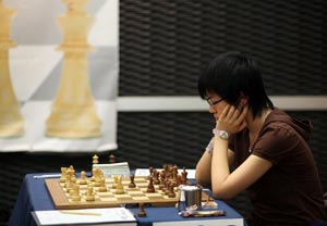 Hou Yifan started with a win. Photo © Anastasiya Karlovich.