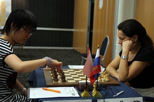 Hou Yifan beat Alexandra Kosteniuk in Round 3. Photo © Anastasiya Karlovich.