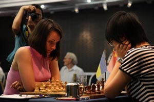 Kateryna Lahno handed out a bit of a beating to previously overwhelming leader Hou Yifan in round 9. White won every single game in the round and  Tatiana Kosintseva moved within a point of the World Champion. Photo © Anastasiya Karlovich. 