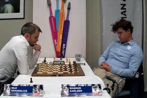 Nils Grandelius in thought against Magnus Carlsen in Round 2. Photo &copy; 