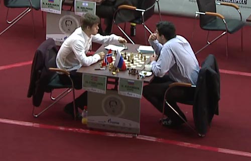 Magnus Carlsen discusses his game with Vladimir Kramnik after the draw was agreed
