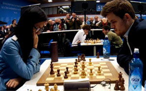 Hou Yifan blundered within sight of a draw against Magnus Carlsen. Photo © 