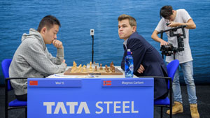 Wei Yi and Magnus Carlsen drew their first meeting. Photo © 