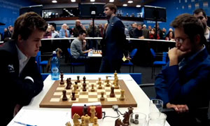 Magnus Carlsen held a draw as black against Levon Aronian. Photo © 