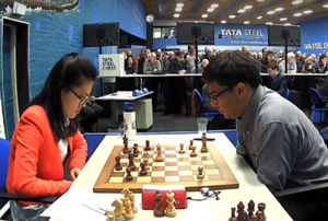 Hou Yifan was defeated by Viswanathan Anand who now moves within half a point of the lead after Round 11. Photo © 