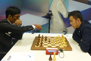 Nodirbek Abdusattorov joined the leaders after defeating Praggnanandhaa following a mistake in the endgame. Photo &copy; Michiel Abeln.