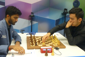 Gukesh and Abdusattorov at the start of their game. Photo &copy; Michiel Abeln
