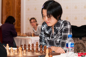 Hou Yifan took clear first place after holding Antoaneta Stefanova in the final round with black. Photo ©