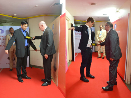 Both Anand and Carlsen go through security for electronic devices