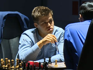 Carlsen and Anand discuss the draw afterwards. Photo © 