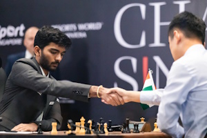 Gukesh and Ding shake hands at the end of game 3. Photo © FIDE.