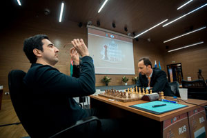 Kramnik and Topalov ignoring each other at the start of their game. Photo © 